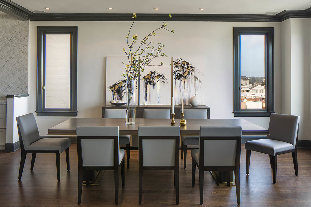 Photo of a transitional dining room in San Francisco with beige walls and dark hardwood floors.