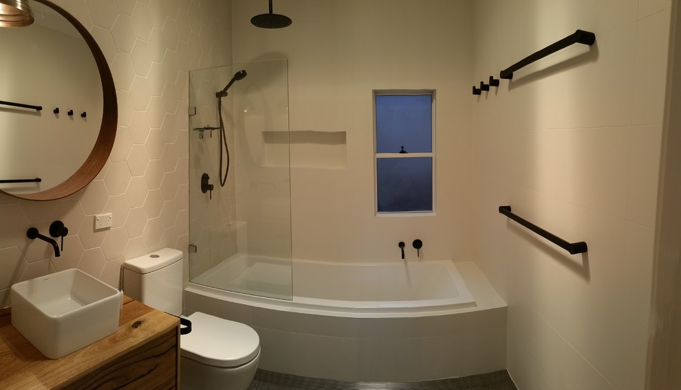 This is an example of a mid-sized scandinavian bathroom in Sydney.