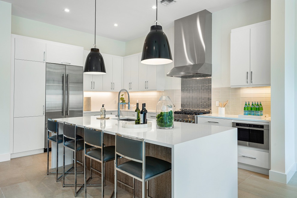 Example of a mid-sized trendy l-shaped ceramic tile and beige floor kitchen design in Miami with a single-bowl sink, flat-panel cabinets, white cabinets, quartz countertops, stainless steel appliances, an island, white countertops and white backsplash