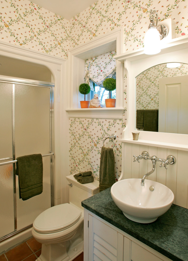 This is an example of a small traditional bathroom in Philadelphia with a vessel sink, white cabinets, granite benchtops, an alcove shower, white walls, terra-cotta floors, louvered cabinets and green benchtops.
