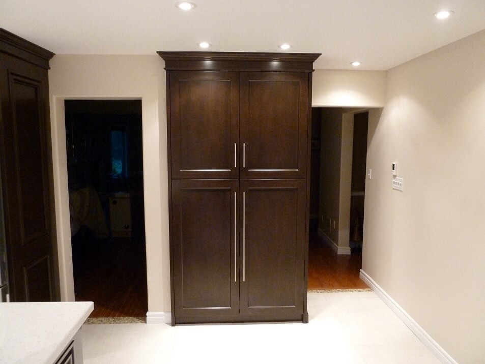 Transitional porcelain tile and beige floor eat-in kitchen photo in Toronto with a double-bowl sink, shaker cabinets, dark wood cabinets, quartz countertops, white backsplash, subway tile backsplash, stainless steel appliances and white countertops