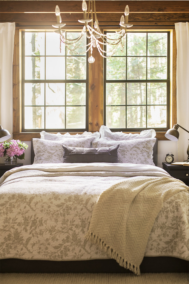 Inspiration for a mid-sized traditional master bedroom in Tampa with white walls, laminate floors and brown floor.
