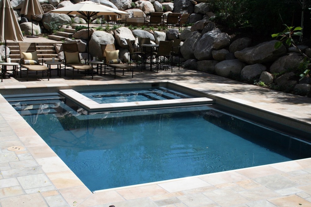 Pool - mid-sized rustic backyard stone and rectangular pool idea in Denver