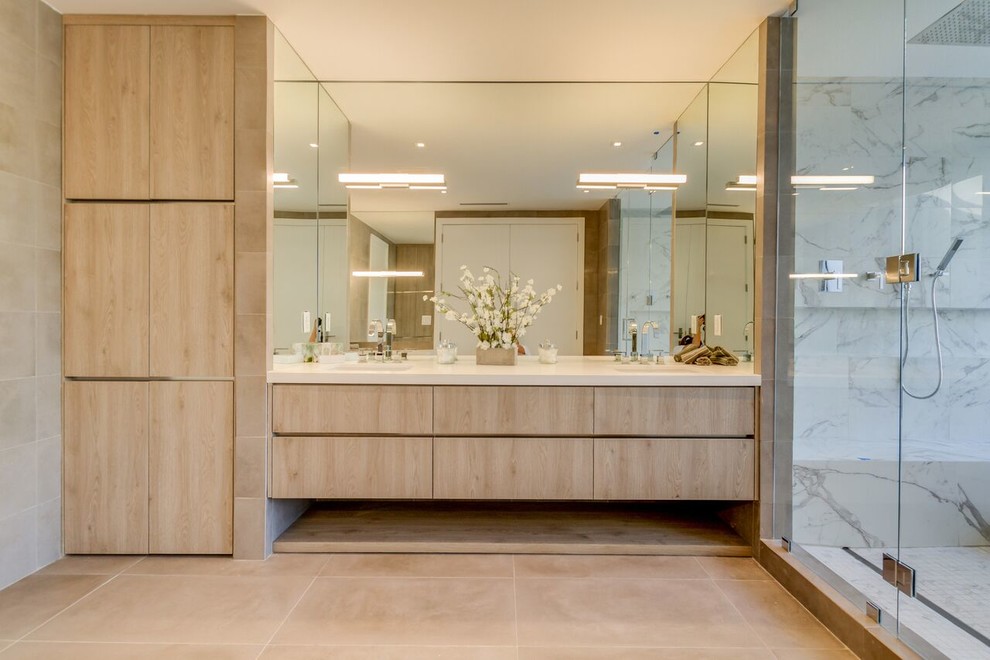 Large contemporary master bathroom in Miami with flat-panel cabinets, beige cabinets, a freestanding tub, a double shower, white tile, marble, brown walls, an undermount sink, engineered quartz benchtops, beige floor and a hinged shower door.