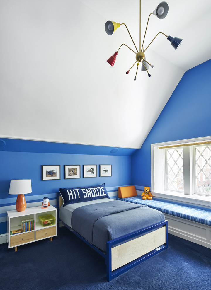 Design ideas for a mid-sized transitional kids' bedroom for boys and kids 4-10 years old in New York with blue walls, carpet and blue floor.