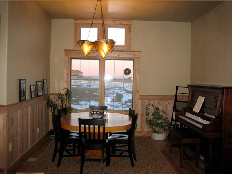 Mid-sized arts and crafts separate dining room in Other with beige walls, light hardwood floors and no fireplace.