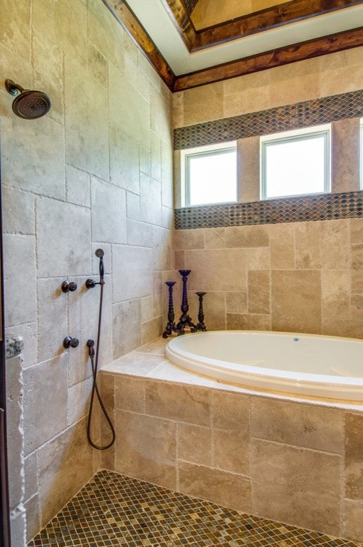 Mid-sized country master bathroom in Dallas with raised-panel cabinets, dark wood cabinets, an alcove tub, a shower/bathtub combo, a two-piece toilet, beige tile, ceramic tile, beige walls, ceramic floors, an undermount sink and granite benchtops.