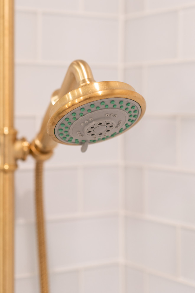 Golden Shower Head in Modern Bathroom with Tiled Walls