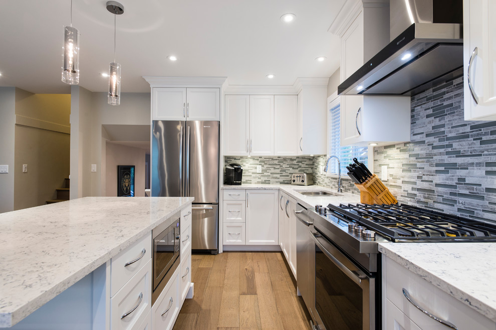 Example of a transitional kitchen design in Vancouver