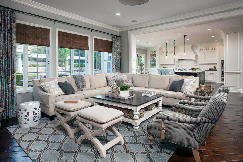 Inspiration for a traditional living room in Orange County with grey walls and dark hardwood floors.
