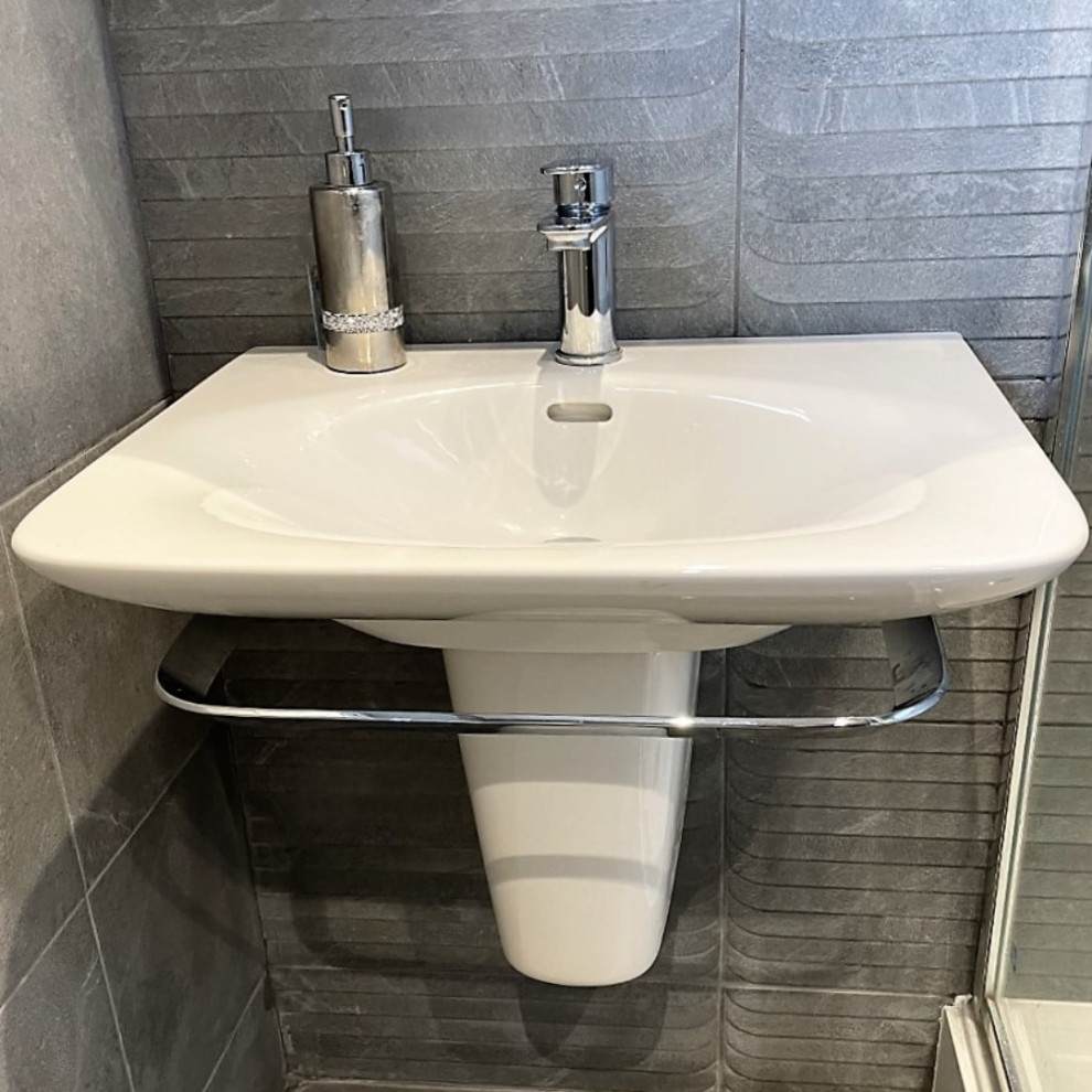 Photo of a mid-sized modern kids bathroom in Other with a corner shower, a two-piece toilet, gray tile, porcelain tile, porcelain floors, a pedestal sink, grey floor, a sliding shower screen and a single vanity.