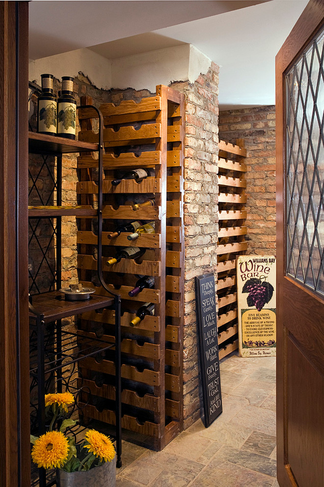 Inspiration for an expansive traditional wine cellar in Chicago with porcelain floors and storage racks.