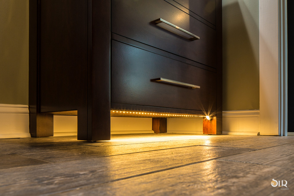 Alcove bathtub - transitional 3/4 dark wood floor and beige floor alcove bathtub idea with flat-panel cabinets, light wood cabinets and gray walls