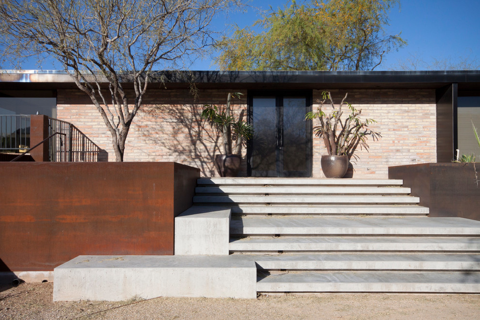 This is an example of a modern concrete straight staircase in Phoenix with concrete risers.