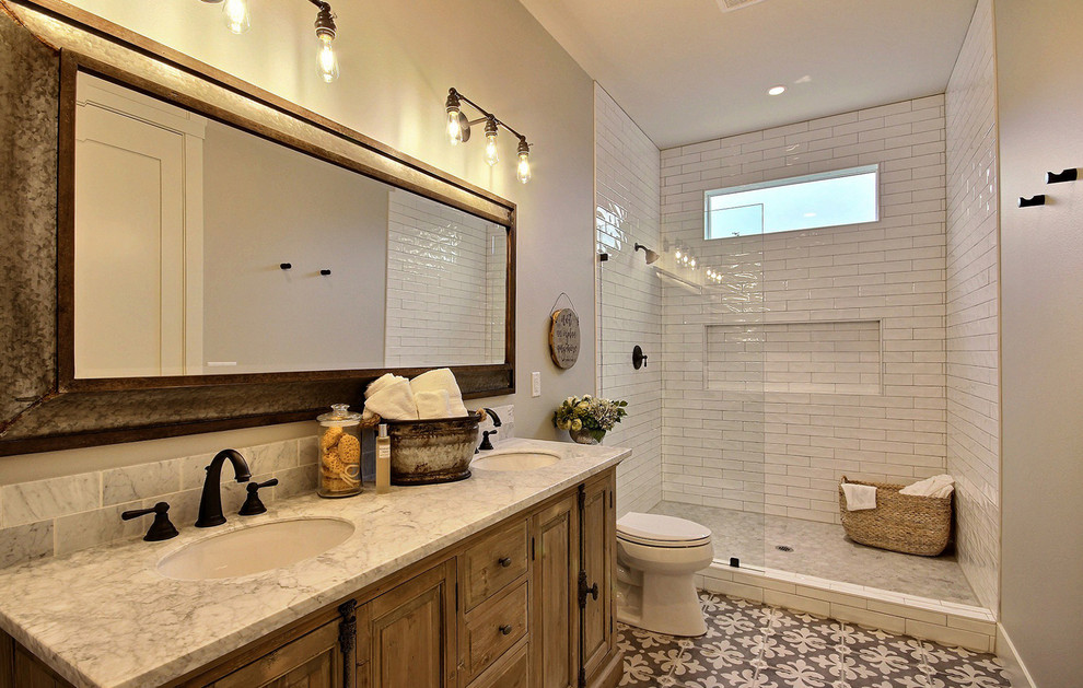 This is an example of an expansive country 3/4 bathroom in Portland with shaker cabinets, distressed cabinets, an alcove shower, a one-piece toilet, white tile, porcelain tile, beige walls, ceramic floors, an undermount sink, engineered quartz benchtops, multi-coloured floor, an open shower and grey benchtops.
