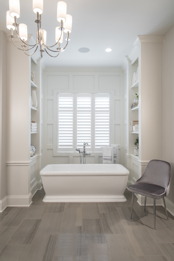 Inspiration for an expansive traditional master bathroom in St Louis with beaded inset cabinets, white cabinets, a freestanding tub, an open shower, a two-piece toilet, medium hardwood floors, an undermount sink, engineered quartz benchtops, brown floor and white benchtops.