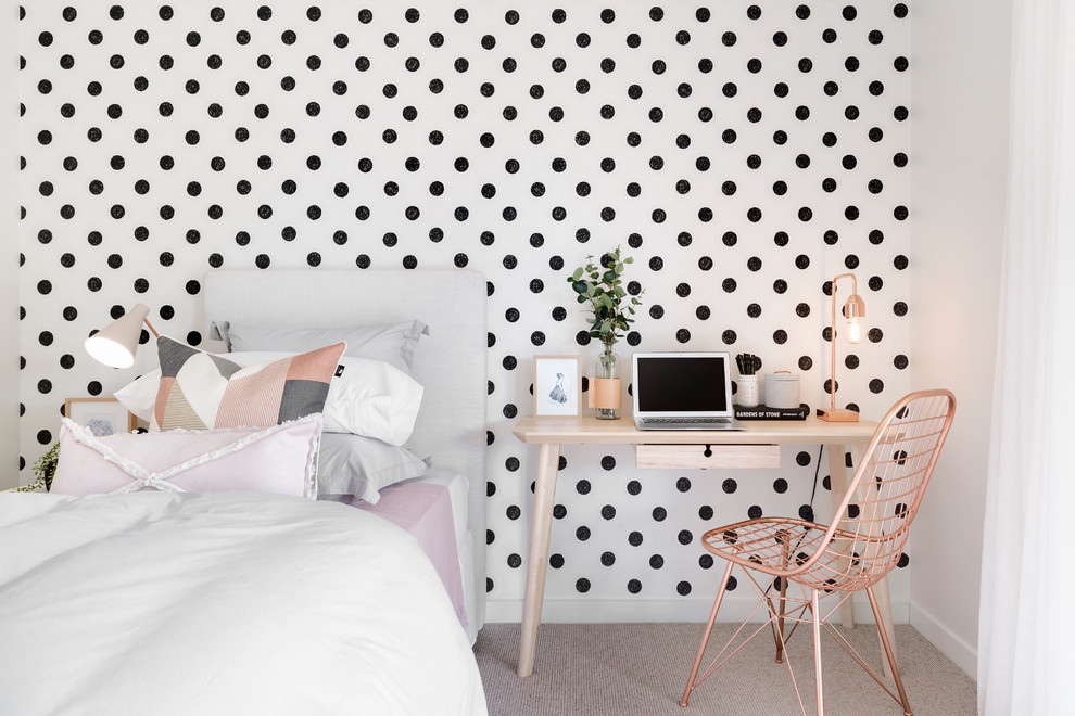 Scandinavian kids' room in Melbourne with multi-coloured walls and carpet for girls.