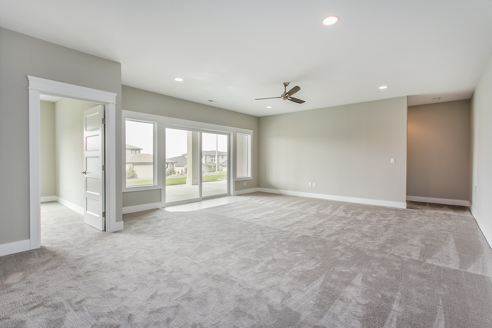 Basement - large transitional walk-out carpeted and gray floor basement idea in Seattle with gray walls and no fireplace