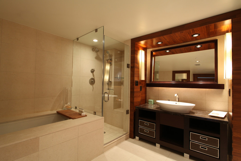 Photo of a large contemporary master bathroom in Toronto with a corner shower, a two-piece toilet, flat-panel cabinets, brown cabinets, a drop-in tub, beige tile, porcelain tile, beige walls, porcelain floors and a vessel sink.