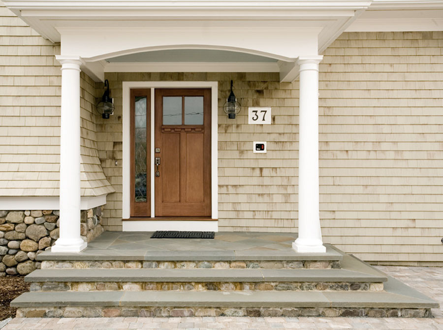 Mid-sized country front door in Providence with beige walls, a single front door, a light wood front door and beige floor.