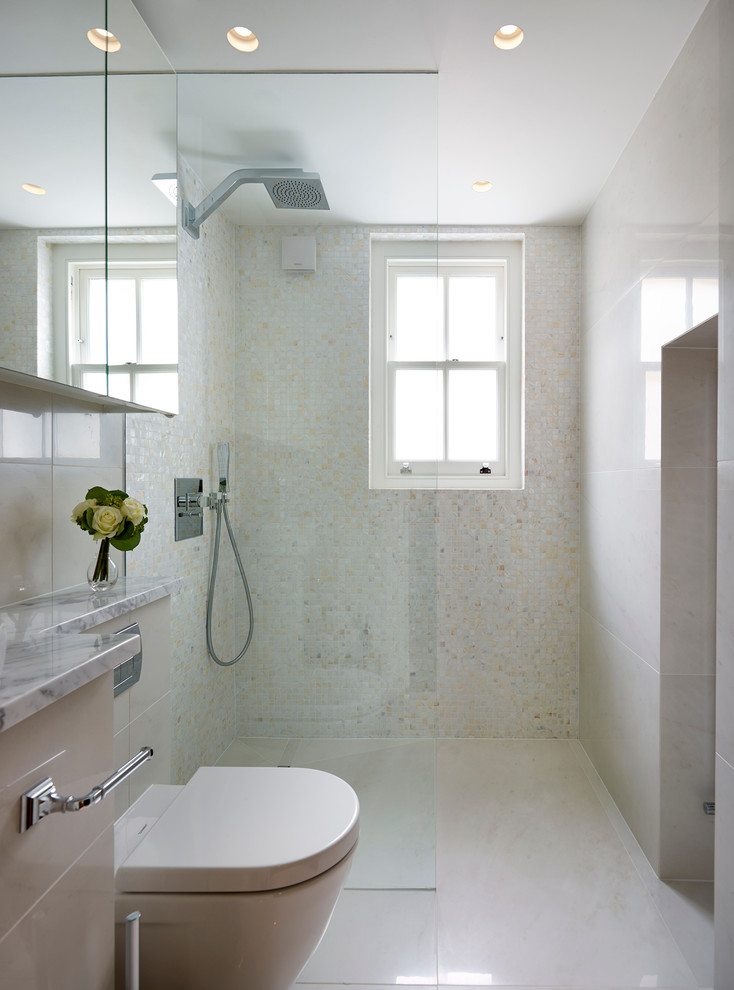 This is an example of a contemporary bathroom in London with an open shower, a one-piece toilet and an open shower.