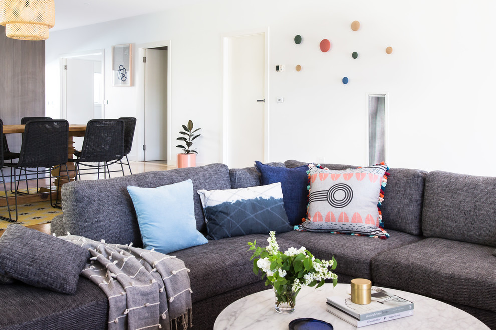 This is an example of a large beach style family room in Melbourne.