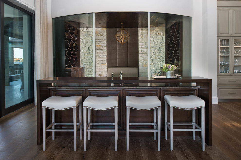 This is an example of a large transitional home bar in Miami with medium hardwood floors and brown floor.