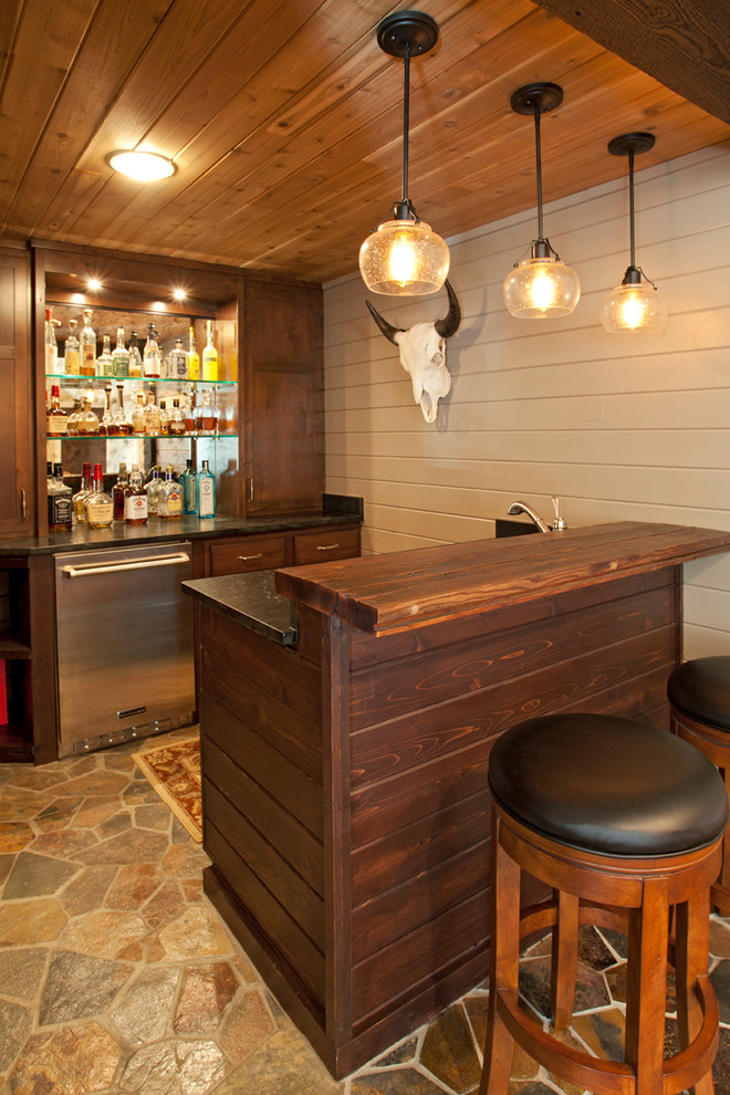 Inspiration for a mid-sized rustic wine cellar remodel in Minneapolis