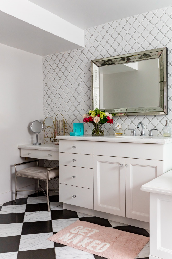 Mid-sized kids bathroom in Salt Lake City with shaker cabinets, white cabinets, a corner tub, a shower/bathtub combo, white tile, porcelain tile, white walls, marble floors, an undermount sink, marble benchtops, a single vanity and a built-in vanity.