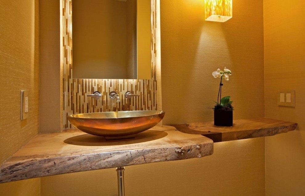 Photo of a large contemporary 3/4 bathroom in San Diego with beige tile, beige walls, a vessel sink and wood benchtops.