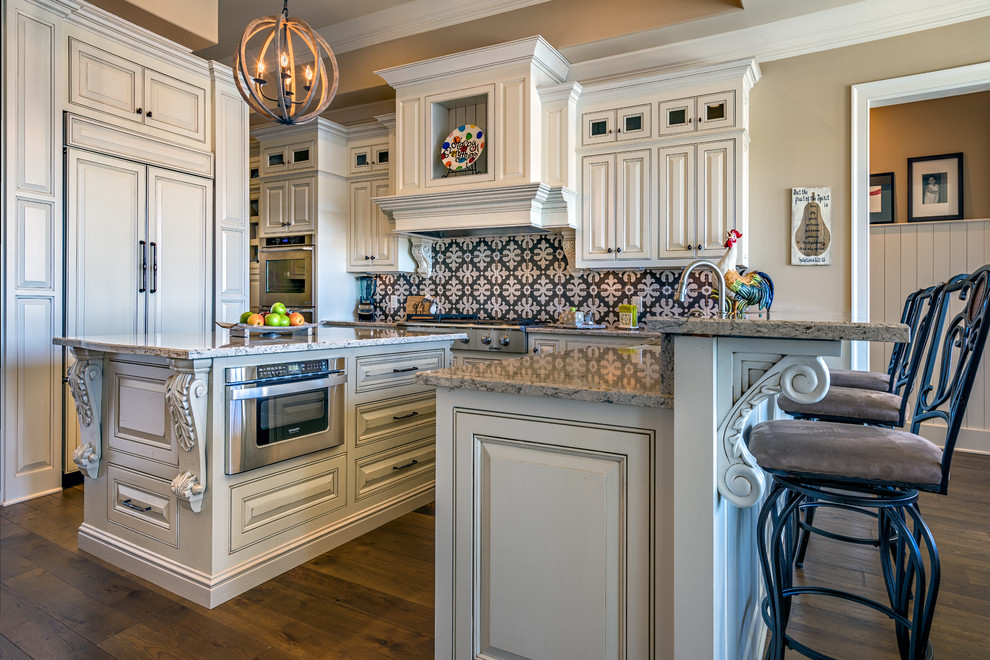 Inspiration for a mid-sized transitional u-shaped dark wood floor eat-in kitchen remodel in Nashville with beaded inset cabinets, distressed cabinets, granite countertops, multicolored backsplash, mosaic tile backsplash, stainless steel appliances and an island