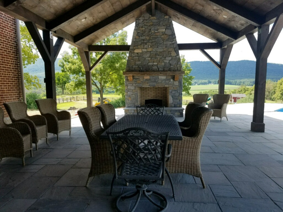 Photo of a large traditional backyard patio in Other with with fireplace, tile and a gazebo/cabana.