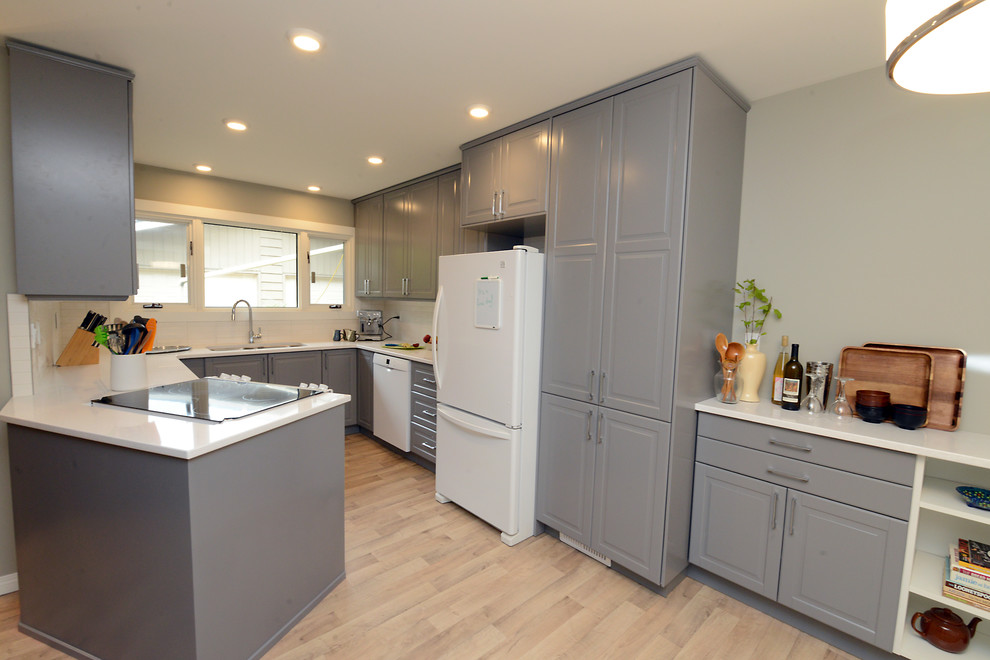Enclosed kitchen - small traditional u-shaped light wood floor and beige floor enclosed kitchen idea with a double-bowl sink, raised-panel cabinets, gray cabinets, quartz countertops, white backsplash, white appliances, no island and white countertops