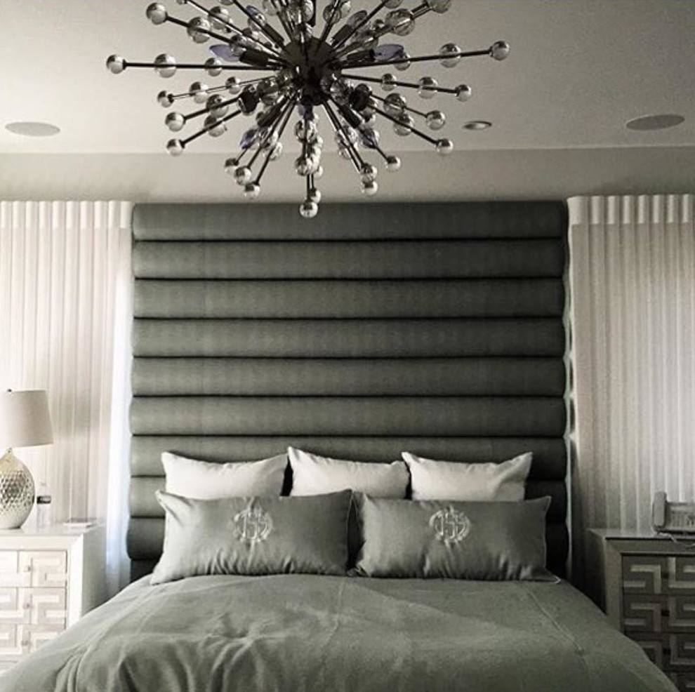 Photo of a contemporary master bedroom in New York with grey walls.