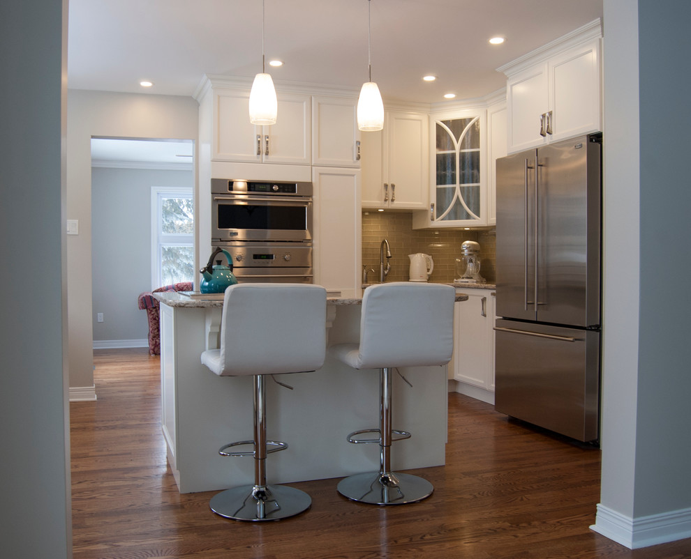 Kitchen - transitional kitchen idea in Ottawa with an island