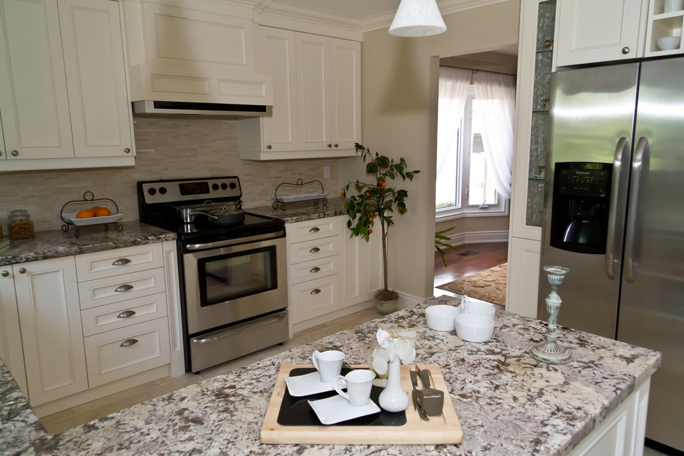 Example of a transitional kitchen design in Toronto