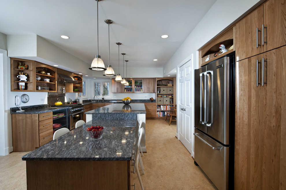 Design ideas for a mid-sized contemporary l-shaped open plan kitchen in DC Metro with stainless steel appliances, granite benchtops, an undermount sink, flat-panel cabinets, medium wood cabinets, linoleum floors and with island.