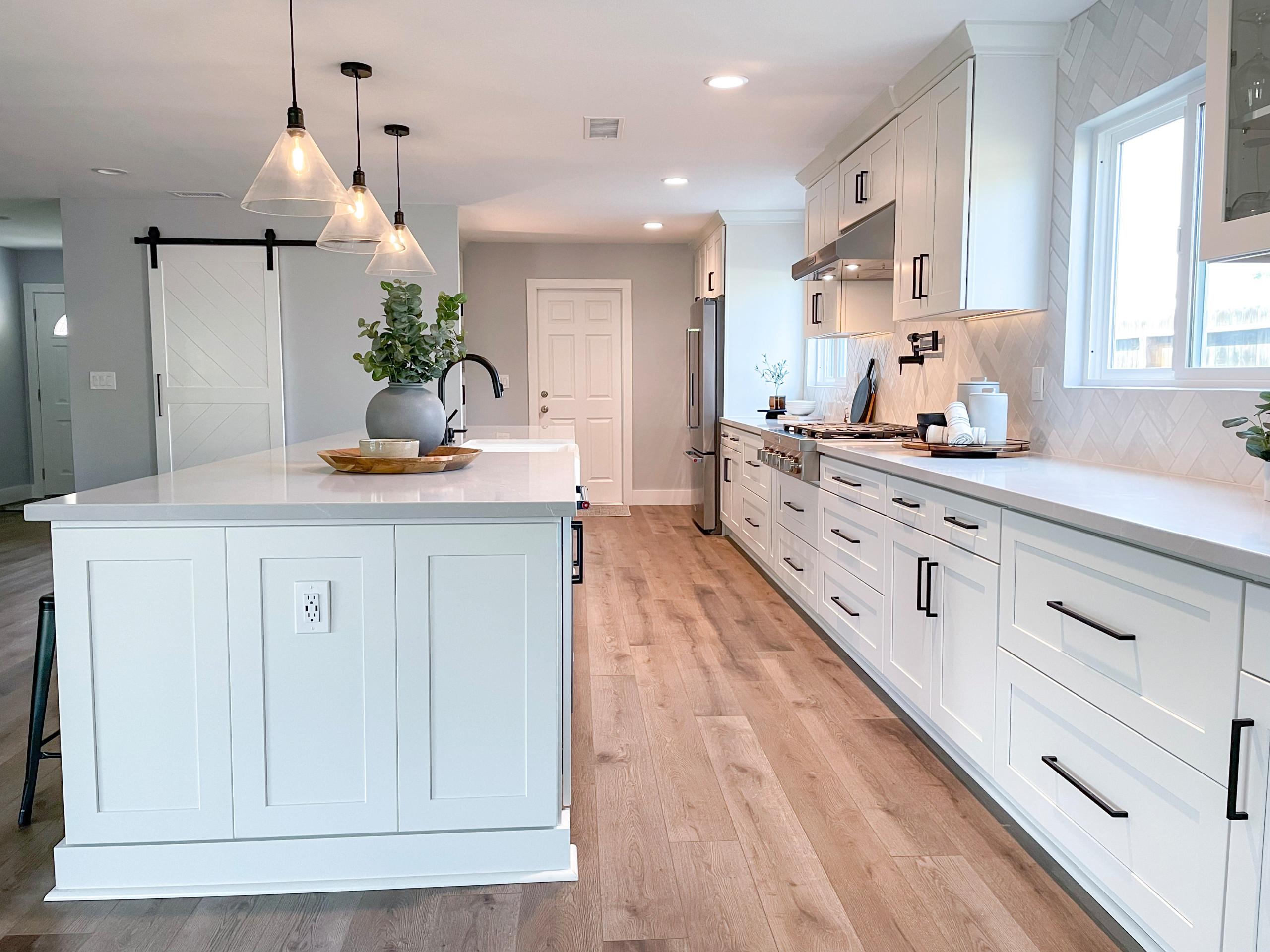 Modern Farmhouse Kitchen with White Cabinet and Black Hardware