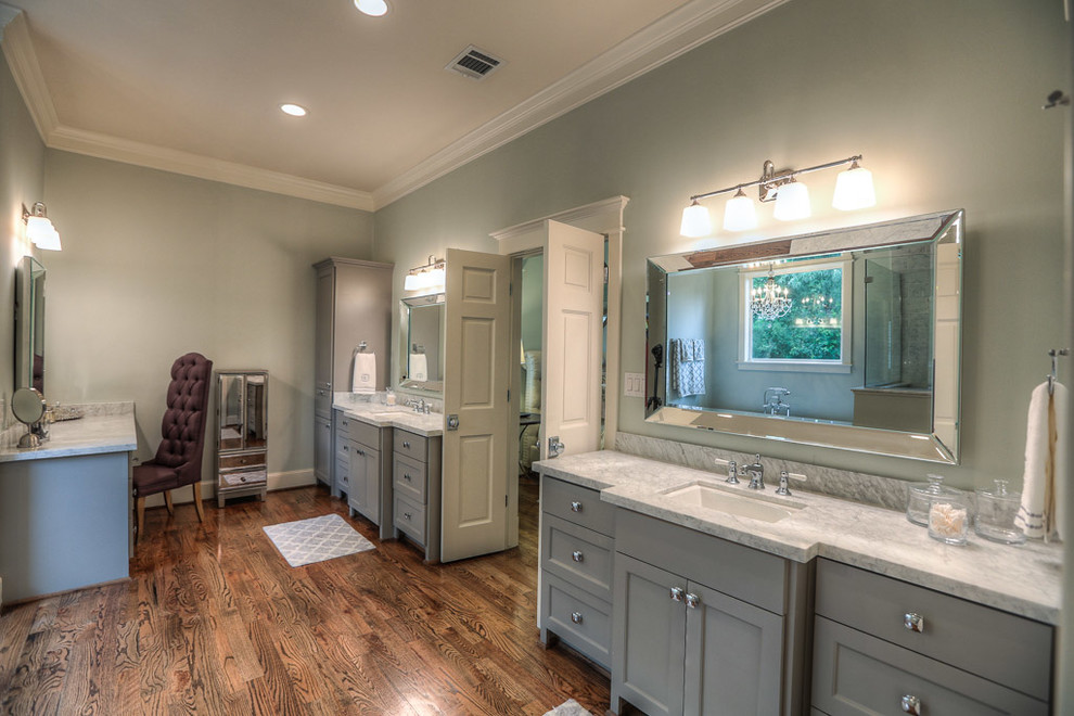 Design ideas for a large arts and crafts master bathroom in Houston with an undermount sink, shaker cabinets, grey cabinets, marble benchtops, a freestanding tub, grey walls and dark hardwood floors.