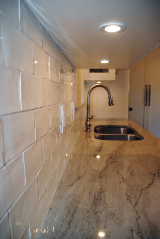 Example of a transitional home design design in Vancouver