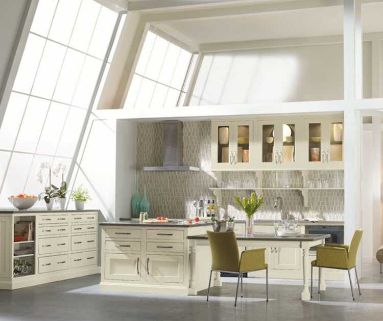 Example of a mid-sized transitional l-shaped dark wood floor and brown floor eat-in kitchen design in Orange County with an undermount sink, recessed-panel cabinets, white cabinets, granite countertops, beige backsplash, ceramic backsplash, stainless steel appliances and an island