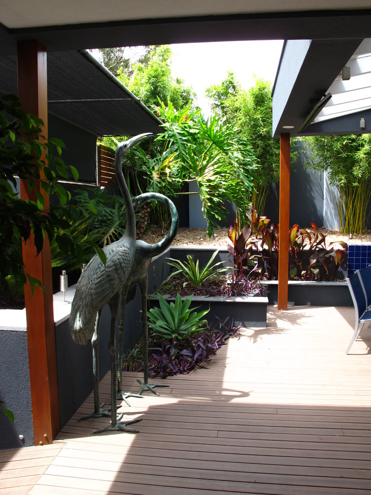 Photo of a mid-sized contemporary courtyard patio in Adelaide with decking and a roof extension.