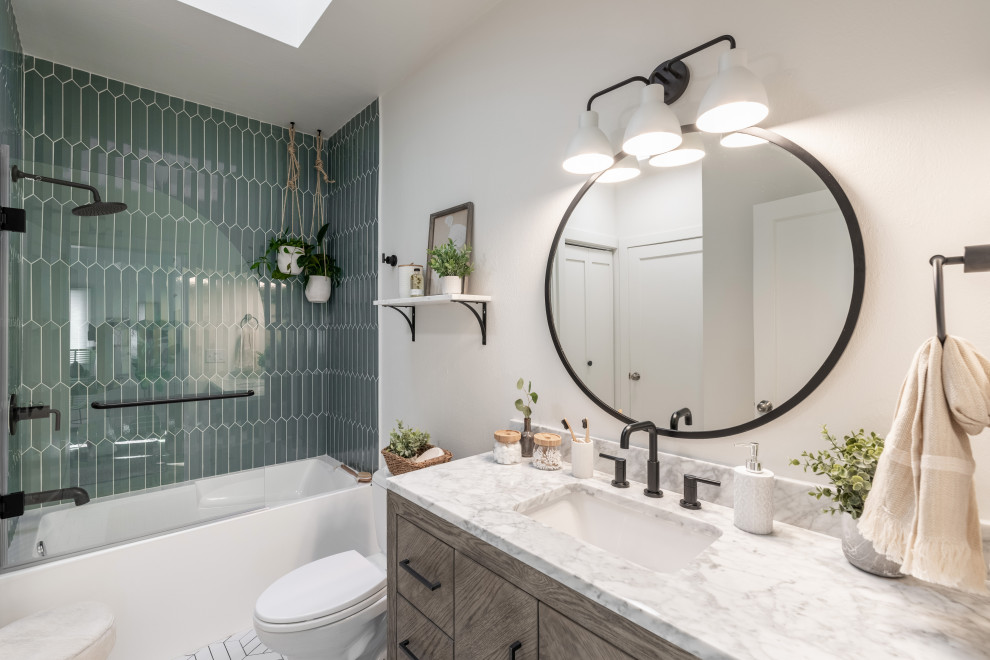 Photo of a medium sized contemporary shower room bathroom in San Francisco with flat-panel cabinets, distressed cabinets, an alcove bath, a shower/bath combination, a two-piece toilet, green tiles, porcelain tiles, white walls, porcelain flooring, a submerged sink, marble worktops, white floors, an open shower, white worktops, a single sink and a freestanding vanity unit.