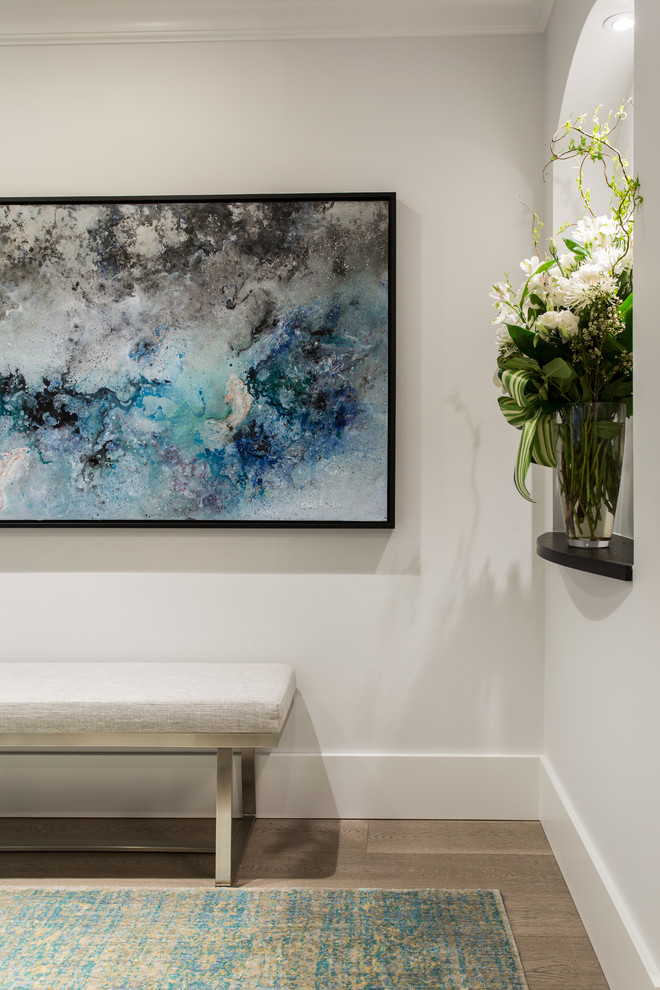 Inspiration for a small transitional medium tone wood floor and beige floor foyer remodel in Vancouver with gray walls and a gray front door