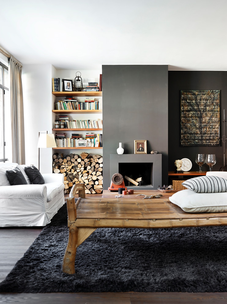 Inspiration for a scandinavian open concept living room in Other with a standard fireplace, grey walls, medium hardwood floors and brown floor.