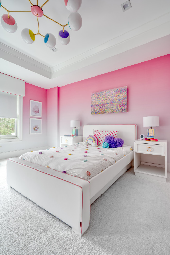 Photo of a mid-sized modern kids' bedroom for girls in New York with pink walls, carpet and white floor.
