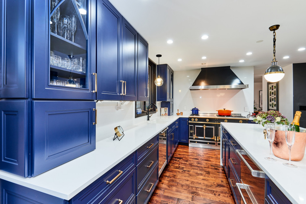 Entertainer’s Navy Kitchen With Polished Metal Accents