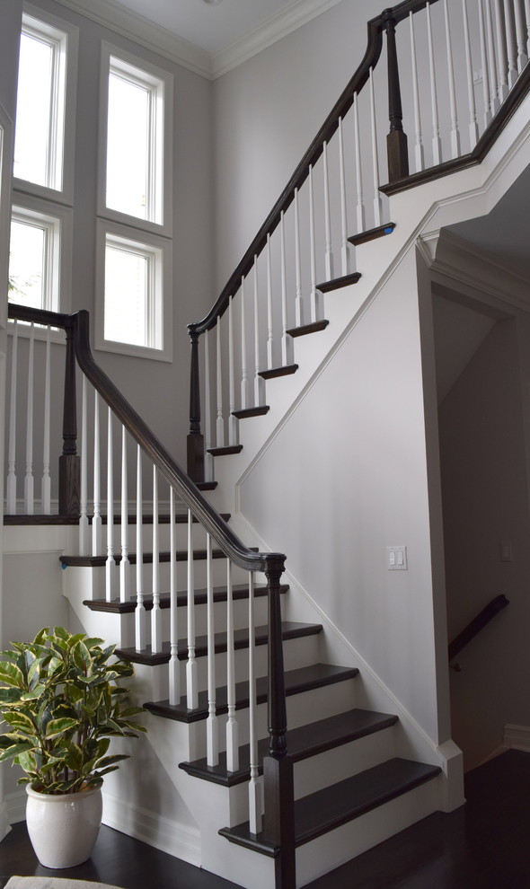 Mid-sized traditional wood l-shaped staircase in New York with painted wood risers.
