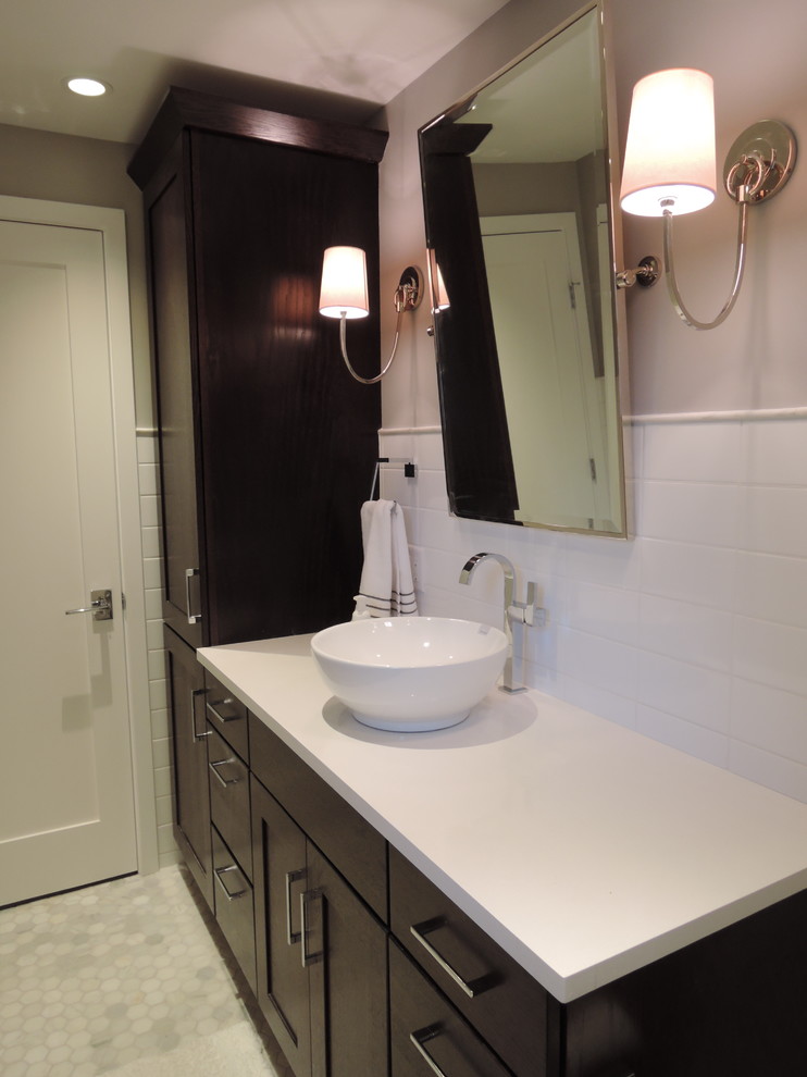 Design ideas for a small modern kids bathroom in Indianapolis with a vessel sink, recessed-panel cabinets, beige cabinets, quartzite benchtops, a drop-in tub, a shower/bathtub combo, a two-piece toilet, white tile, ceramic tile, grey walls, marble floors and grey floor.