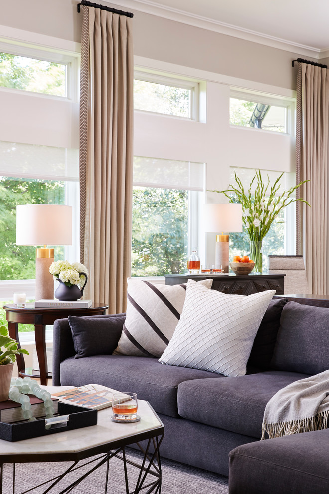 This is an example of a large transitional open concept living room in Minneapolis with beige walls, medium hardwood floors and brown floor.